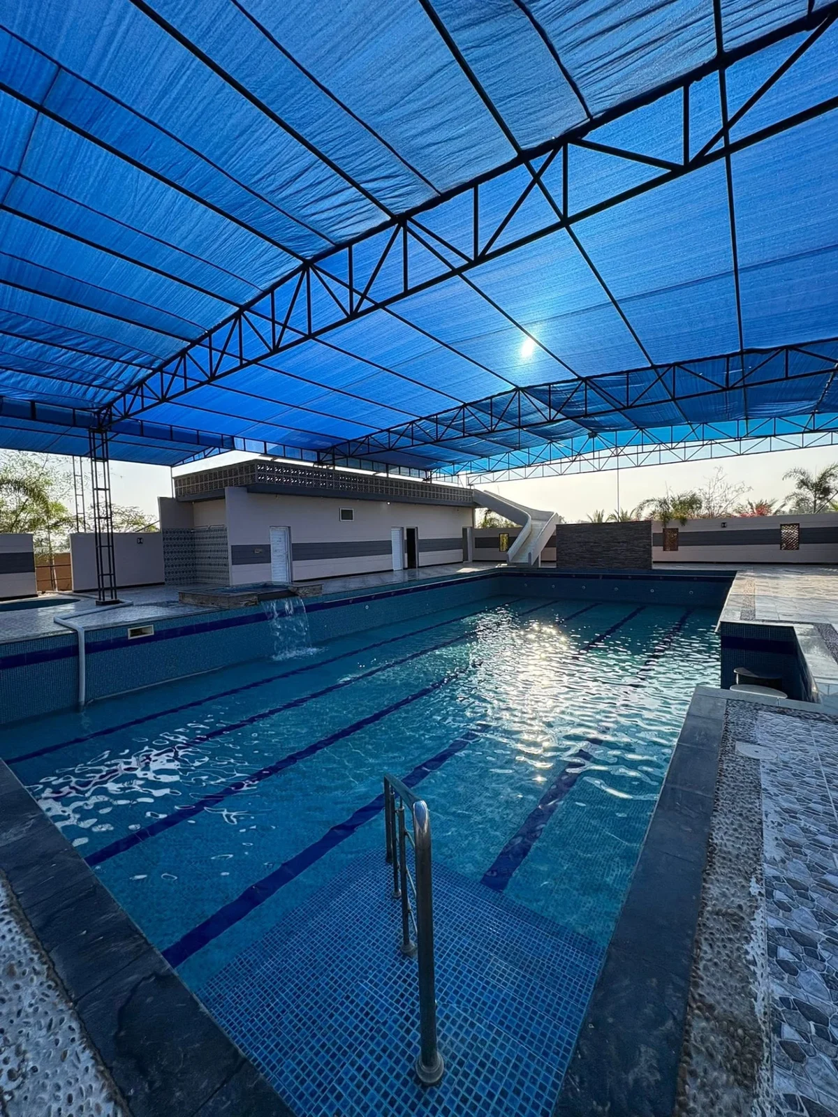 Covered pool under the blue canopy